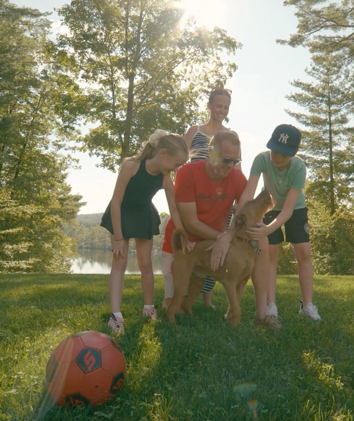 A Capital Region family enjoying their yard with their dog